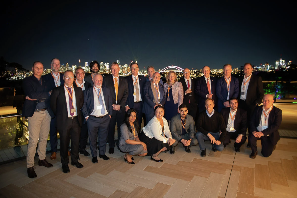 Employees and guests celebrated the anniversary against the night-time skyline of Sydney.